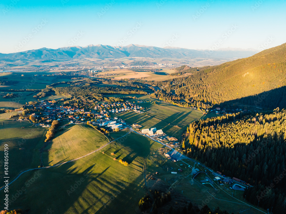 Sunset over Liptov region with and High Tatras mountains around. Liptovsky Mikulas landspace, slovakia.