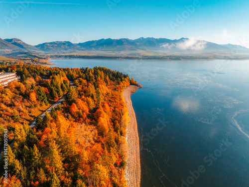 Obraz na płótnie Liptov region with Tatras mountains around. Liptovska mara dam landspace. Autumn deciduous forest view from above w salonie