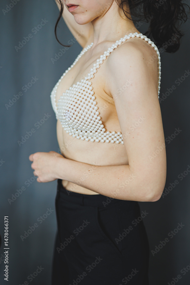 The PearlEmbellished Bra paired with Black Trousers forms an Elegant Fashion Statement, embodying creativity and boldness in a chic ensemble that inspires confidence and individuality