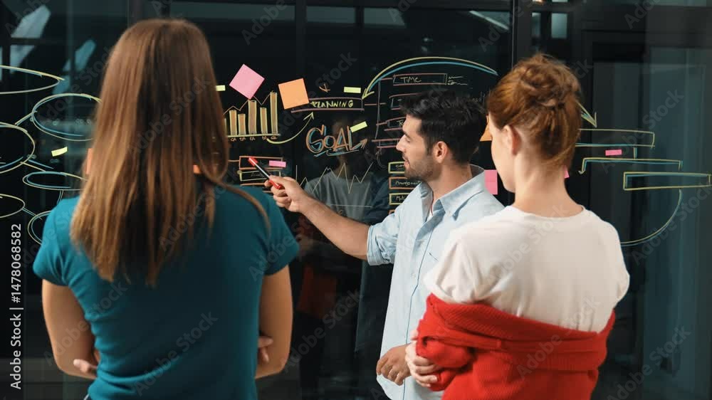 Professional businessman presenting marketing idea or financial plan to smart investor. Executive manager sharing, talking, working together with cooperative colleagues. Business concept. Tracery