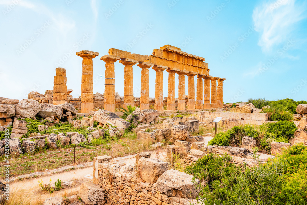 Fototapeta premium Greek temples at Selinunte of Temple of Apollo (C) with ruins of Greek columns in Selinunte Archaeological Park Sicily Italy