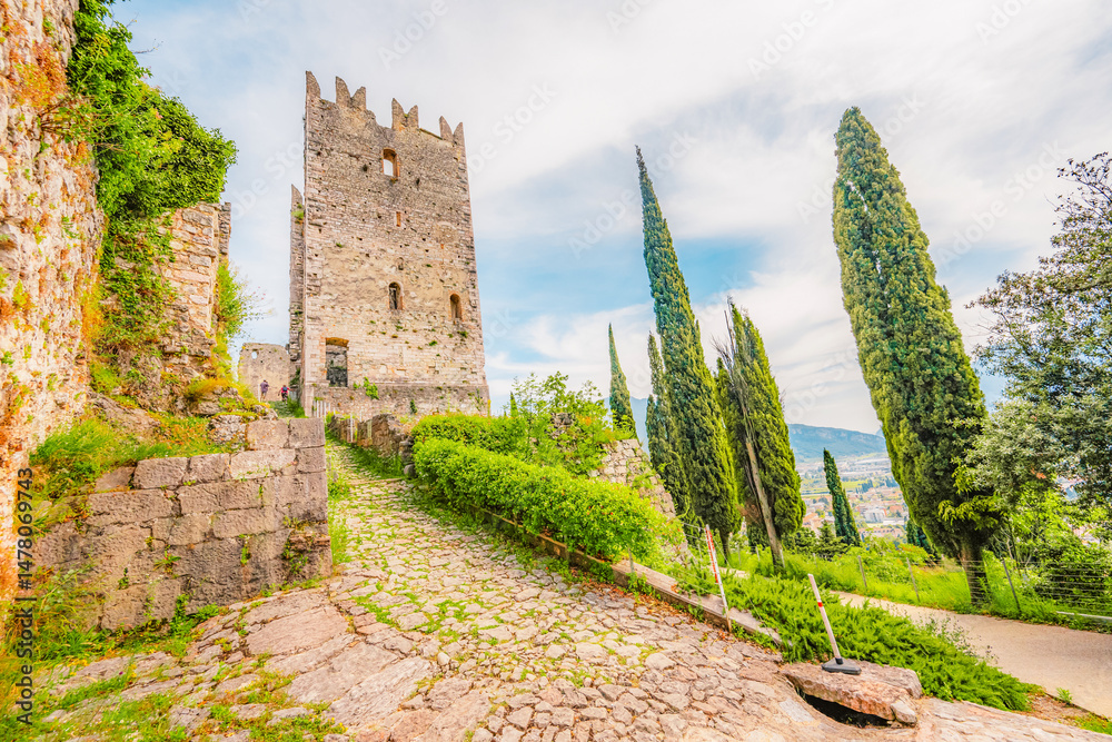Arco castle ruins on cliffs above Garda lake, Trentino, Italy. Lago di garda