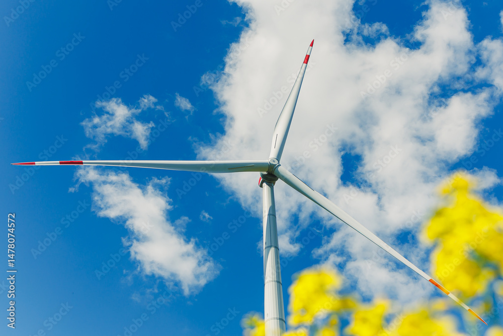 Large windmill turbine for energy generation. Ecological energy generation by windmills on the sky background.
