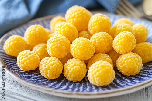 plate yellow raspberries with beeswax wrap on