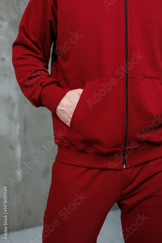 Obraz na płótnie Introducing our stylish and trendy casual red tracksuit, which is perfect not only for your gym workouts but also for daily wear, ensuring you look great whether exercising or just hanging out w salonie