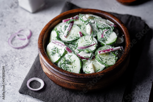 Cucumber red onion dill salad in a bowl
