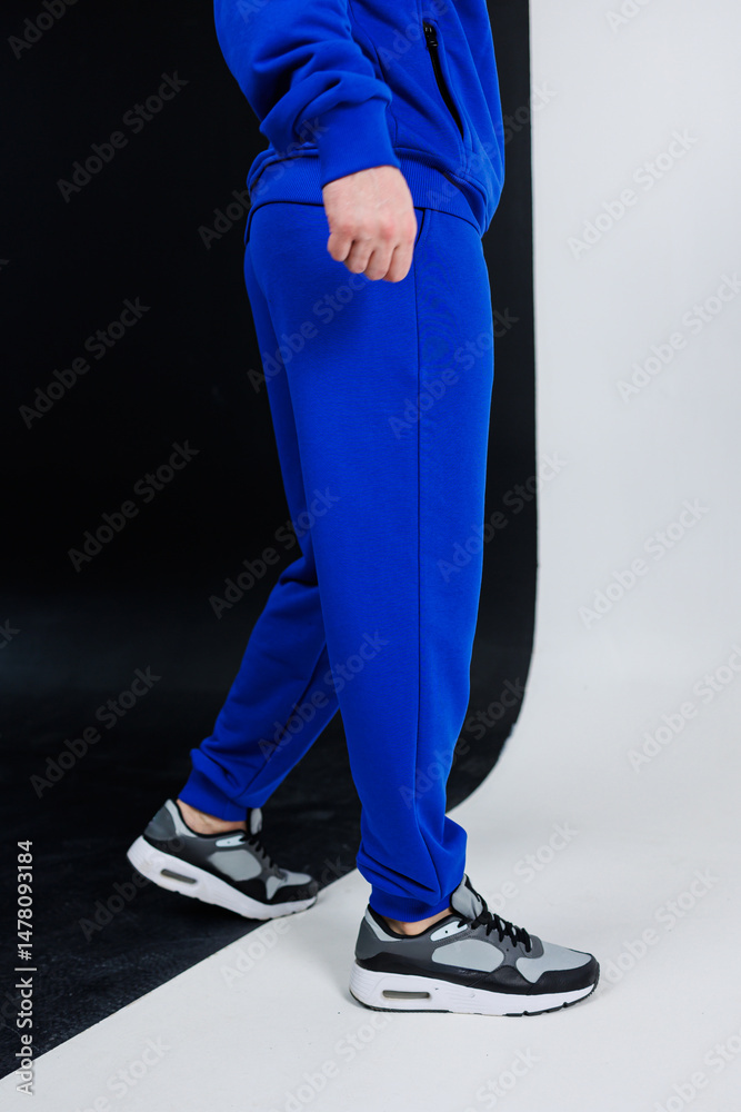 Experience the ultimate in fashionable casual sportswear with our blue tracksuit, perfectly paired with stylish sneakers, designed for those who lead an active lifestyle and love to stay fit