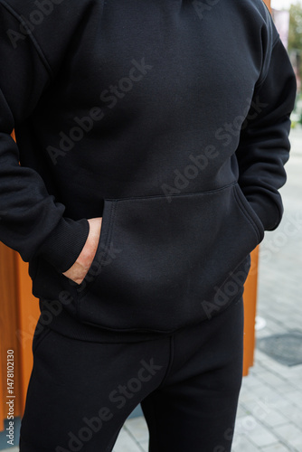 Discover our trendy and stylish black hoodie paired with comfortable joggers, perfect for creating casual streetwear fashion that is not only fashionable but also practical for everyday activities