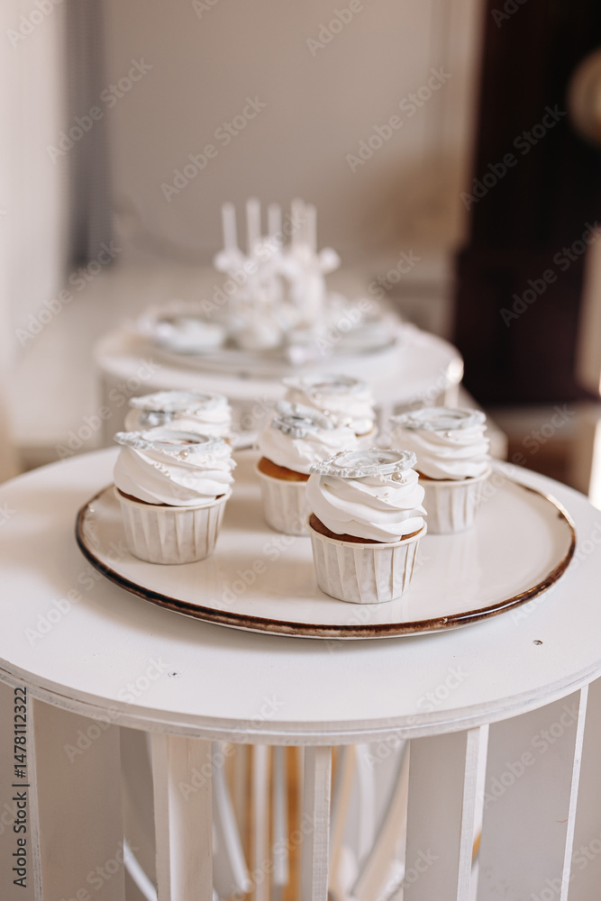 Indulge in Delightful Cupcakes Presented on Elegant White Stands, Perfect for Any Celebration or Gathering You Might Have, Adding a Touch of Charm and Sweetness to Your Special Moments