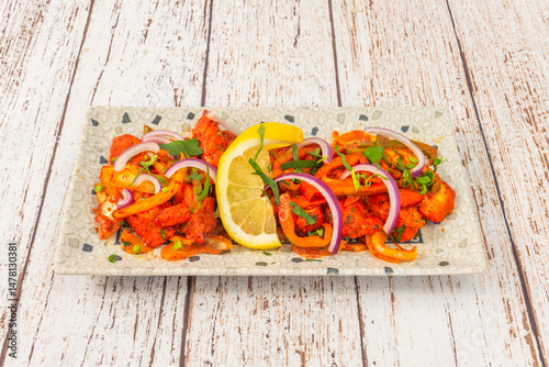 It's moderately spicy in Bangladesh, Pakistan, and India, although in Western countries it's prepared more mildly. Cayenne pepper is used in the original version photo