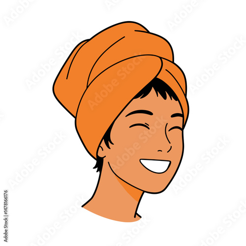 Young woman smiling with orange towel wrap on her head  