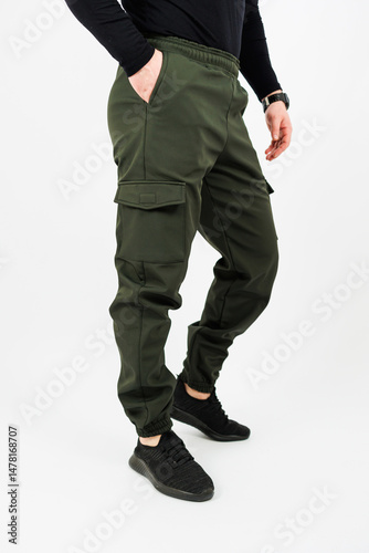 Obraz na płótnie Discover our Stylish Olive Green Cargo Pants designed specifically for men, combining versatility and comfort for the ultimate streetwear experience that effortlessly fits into your wardrobe w salonie