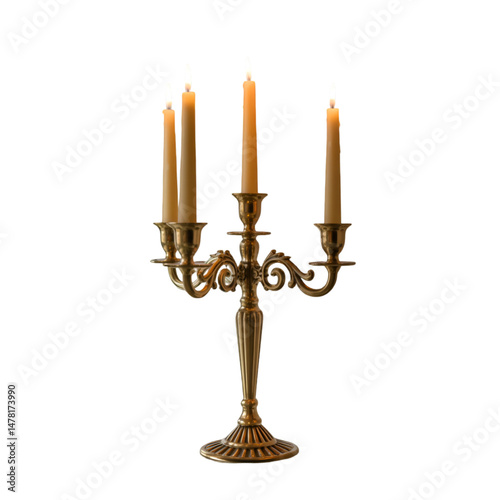 A golden candelabra with four lit candles standing on a black background in a studio setting view