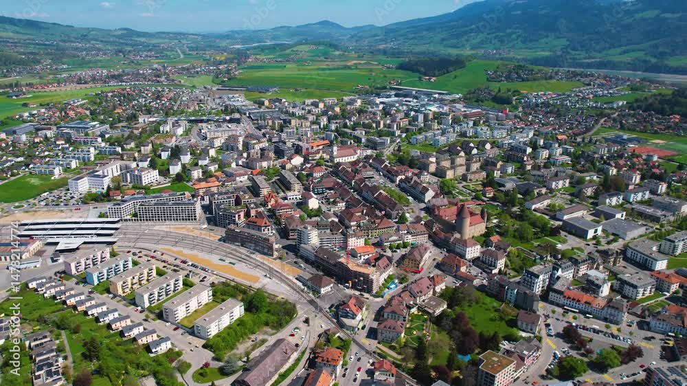 A panoramic aerial view around the old town of the city Bulle in Switzerland on a sunny spring noon