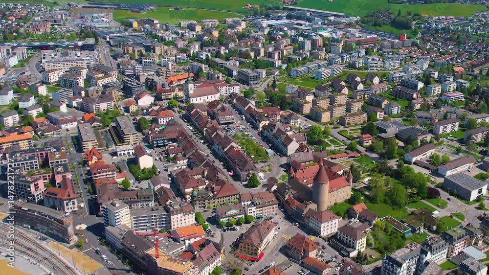 A panoramic aerial view around the old town of the city Bulle Chur in Switzerland on a sunny spring noon