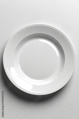 Empty white dinner plate, top view
