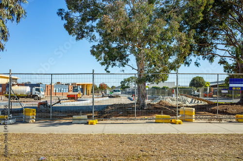 Australian school campus under construction, viewed behind a temporary safety fence—featuring infrastructure development, educational planning, and suburban community growth.