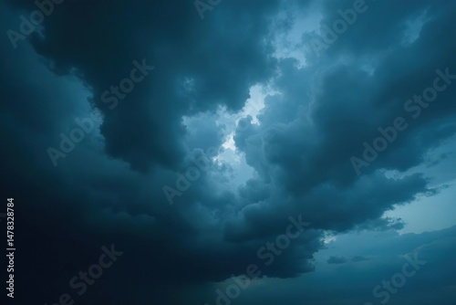 Ominous, dark storm clouds gather overhead, heavy with rain , cloud formations, abstract
