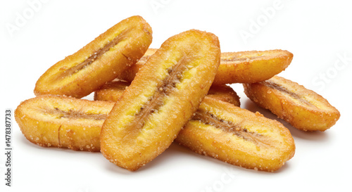 Fried yellow plantain slices stacked in heap on white background photo