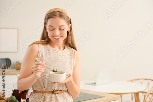 Young woman with tasty okro...