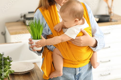 Young mother with little ba...