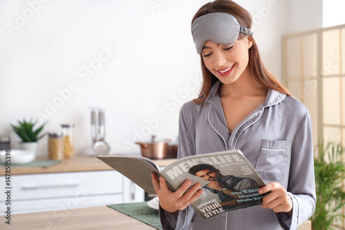 Young woman in pajamas and ...
