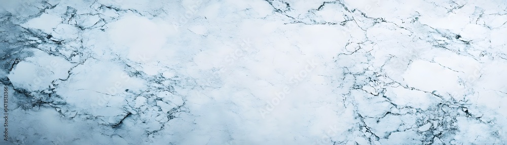 Fototapeta premium Light blue, textured surface with intricate patterns.