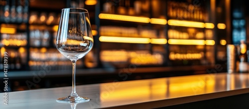 elegant stemware presentation on a luminous counter with a sophisticated blurred backdrop creating a refined ambience in a upscale drinking establishment