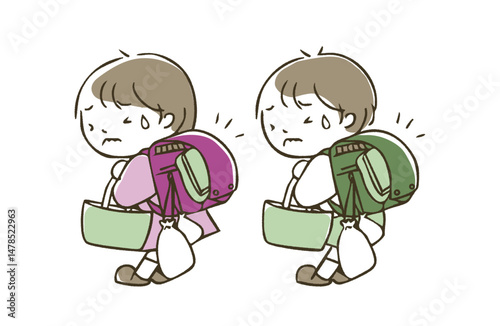 重いランドセルを背負った男の子と女の子