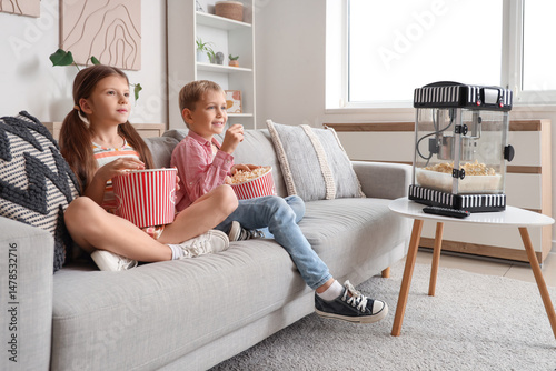 Little children with popcor...