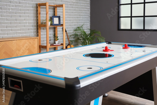 Modern air hockey in room i...
