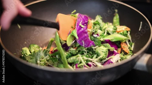 Stirring Vegetables In A Pan On Stove