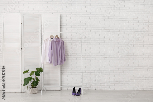 Rack with clothes and foldi...