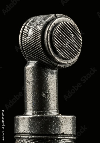 Metal Gear Mechanism Close-up Detail with Textured Surface on Black Background