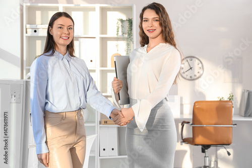 Business women shaking hand...