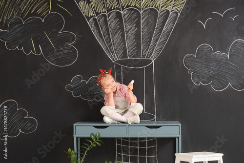 Cute little girl with chalk...