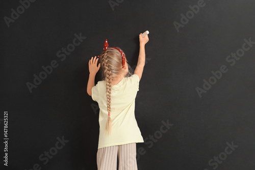 Cute little girl with chalk...