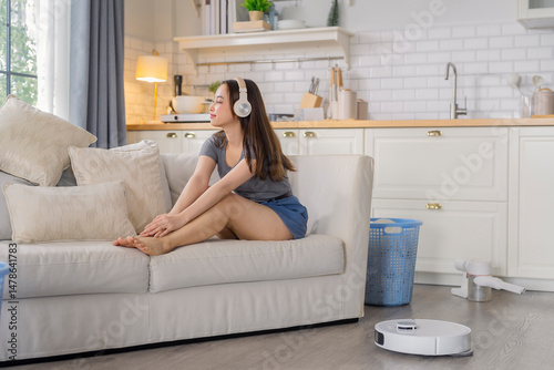 Housewife home working house keeping concept,asian female in casual cloth Woman arranging cushions at home ,household, home improvement and cleaning concept - woman arranging cushions on armchair and 