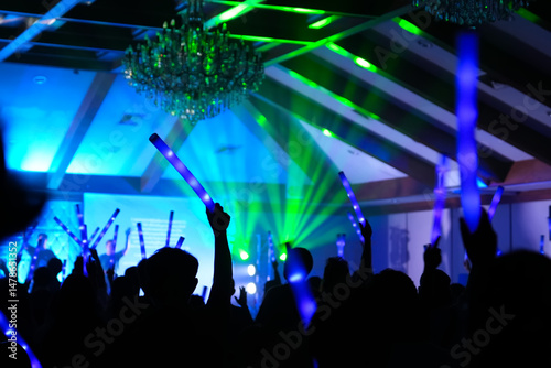 Wallpaper Mural Silhouette Hands Holding Led Light Raising Worshipper Time Music Concert Colorful Stage Light and The Crowd Visible Behind Them Background Torontodigital.ca