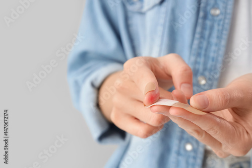 Young woman applying medica...