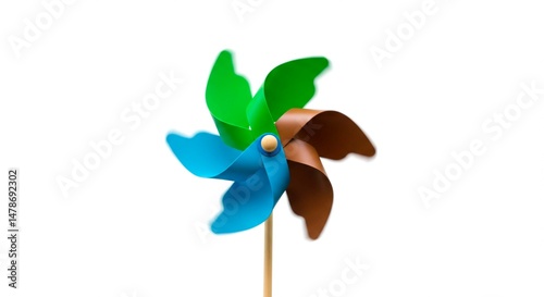 Close up of a colorful pinwheel with blue green and brown blades isolated well