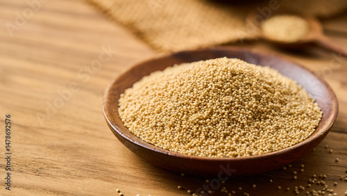 closeup pile of amaranth seed grain whole in wood bowl on wooden table homemade rustic style food background with copy space