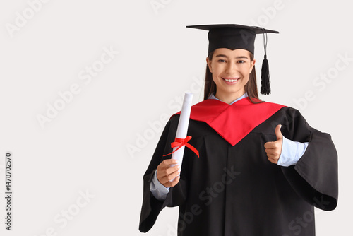 Female graduate with diplom...