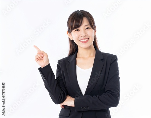 Smiling Japanese Businesswoman Pointing with Copy Space