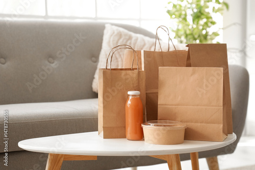 Paper bags with juice on ta...