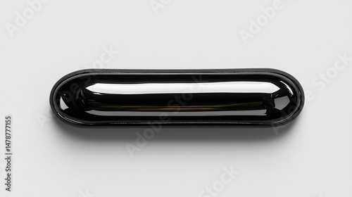 Black shiny oblong object