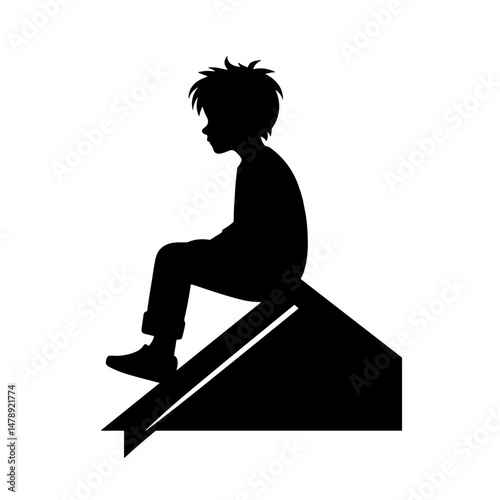 Boy sitting on rooftop alone