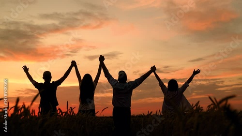 Group farmers teamwork, business group, wheat field harvest, sun. Business people united by one idea. Happy team people holding hands raise hands. Teamwork people. Partnership help in business concept