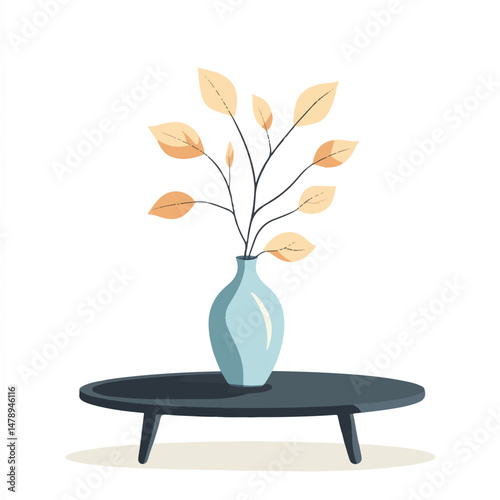 a ceramic vase with leaves on a coffee table 