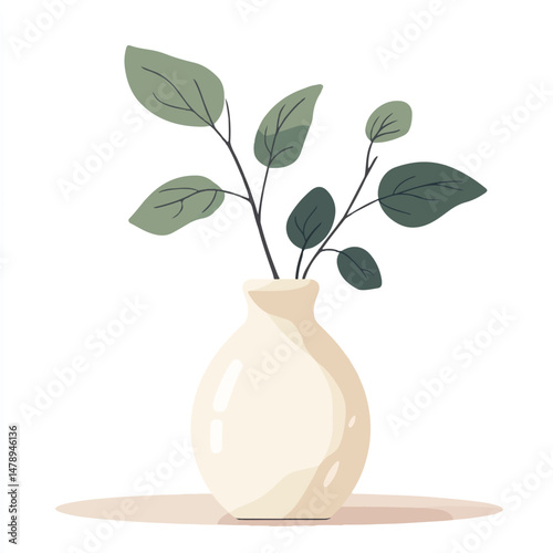 a ceramic vase with leaves on a coffee table 